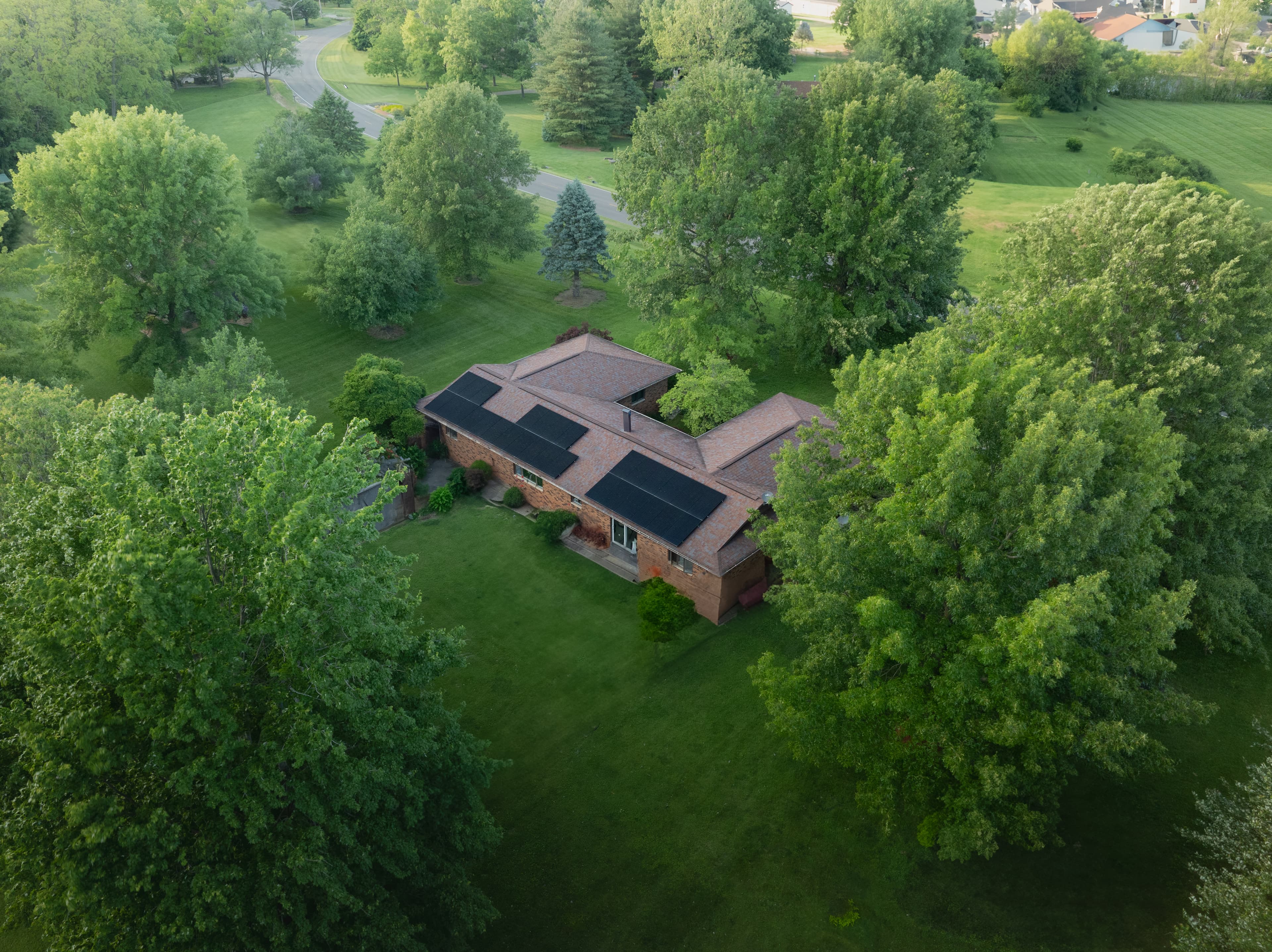 Solar home exterior with mountains in the distance