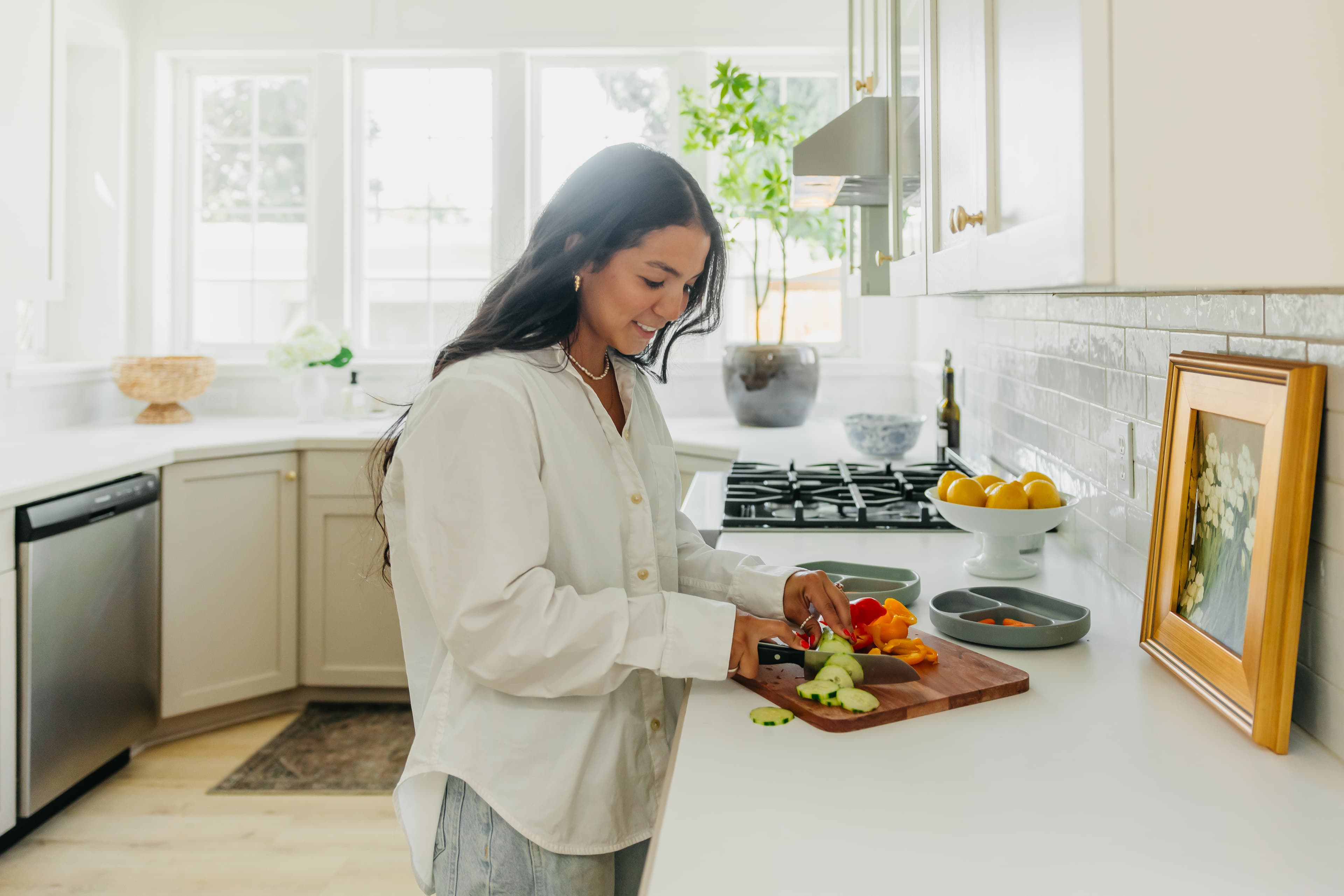 Family in bright modern kitchen, morning light, casual and relaxed