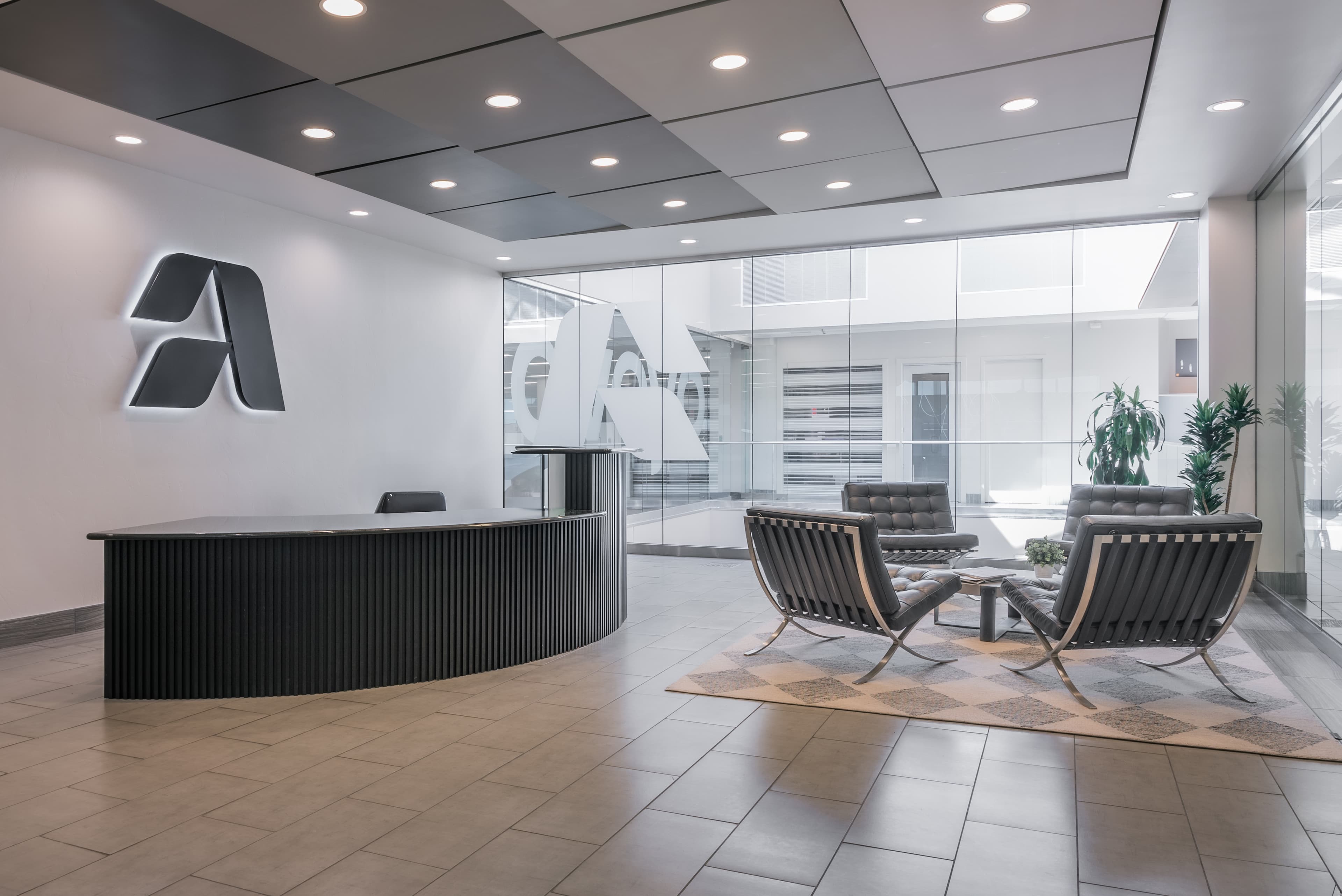 Aveyo office lobby with brand logo, modern reception desk, and seating area